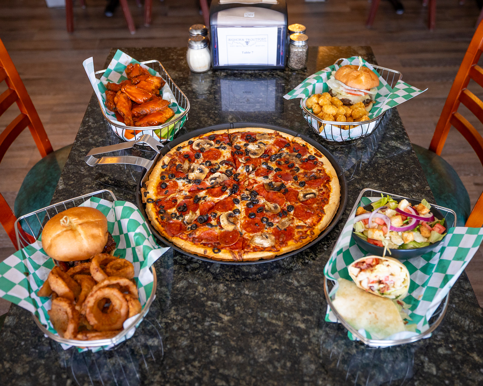 Pizza, burgers, wings, and a wrap at Bighorn Troutpost