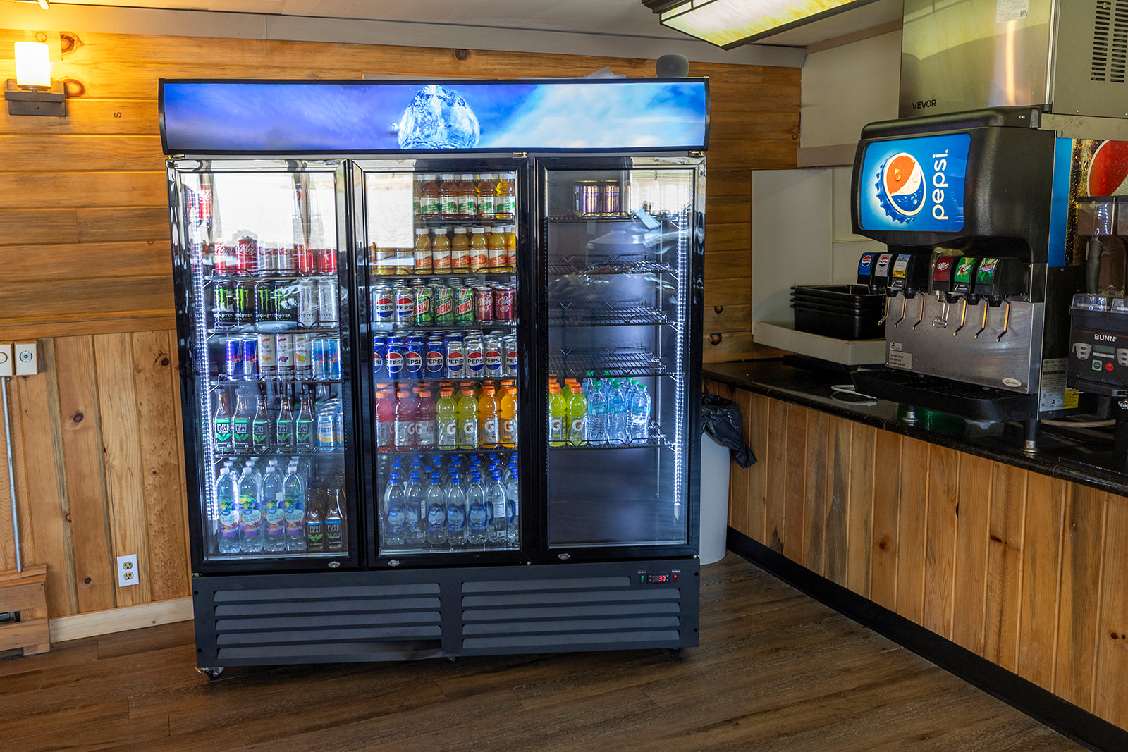 Stocked refrigerated drink cooler at Bighorn Troutpost